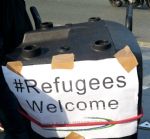 Refugeees Welcome mobile sound system outside court